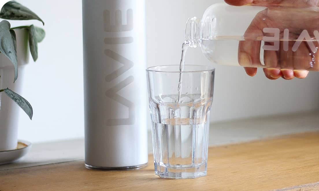 water being poured into a cup