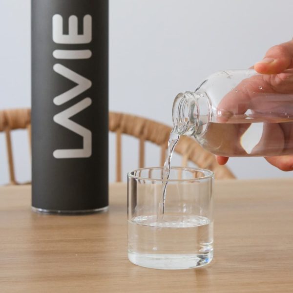 LaVie Pure water bottle and purifier being poured into a glass