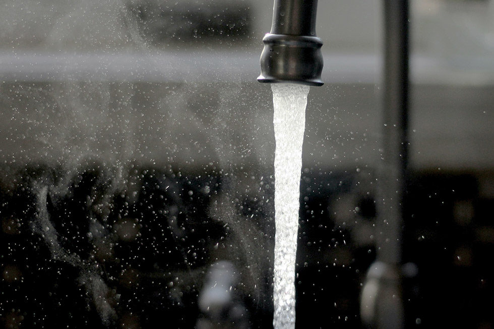 Tap water running from a kitchen faucet